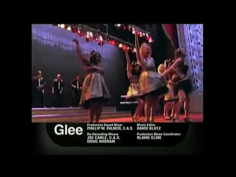 Promo still: stage bathed in gold drape as Regionals medley begins