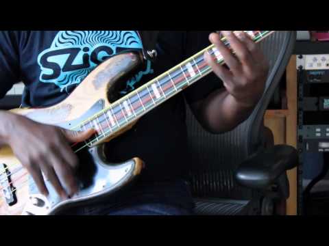 Cameroonian Bass Player Gros Ngolle Pokossi warming up on bass