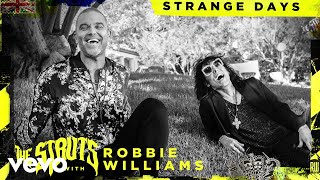 Kadr z teledysku Strange Days tekst piosenki The Struts & Robbie Williams