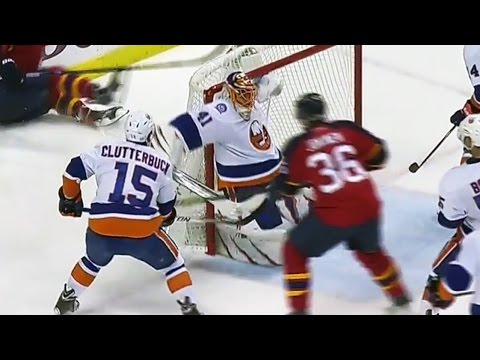 Halak pins puck on crossbar to rob Barkov