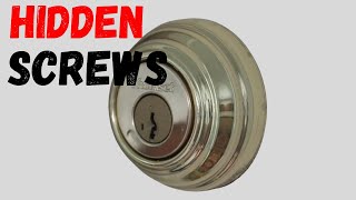 How to remove a deadbolt  with NO Visible SCREWS