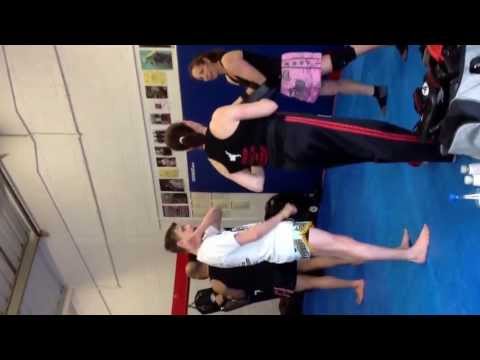 Reece Thomson explaining how to kick Thai style at masters martial arts seminar