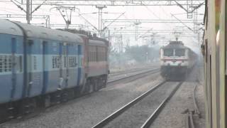 preview picture of video '12434 Chennai Rajdhani Express overtakes 22110 NZM - LTT AC Express at Chhata !!!'