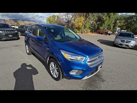 2017 Blue /Gray Ford Escape SE 4WD (1FMCU9GD9HU) with an 1.5L L4 DOHC 16V engine, 6A transmission, located at 450 N Russell, Missoula, MT, 59801, (406) 543-6600, 46.874496, -114.017433 - Cute little One Owner AWD SUV with Goodyear Tires all around. Ready for Winter Roads or Summer Cruising. Fuel Economy Friendly 1.4L I4 Engine. 6 Speed Automatic Transmission. Power Drivers Seat. Dual Climate Control. AM FM CD Player with Bluetooth Audio and Phone Connectivity. Backup Camera. Has a s - Photo#1