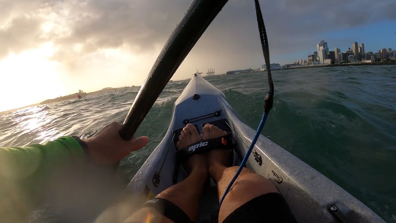 V7 Epic surfski in Auckland. Beautiful dramatic sky.