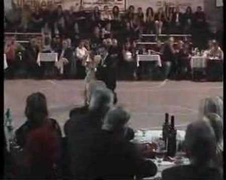  Oscar Martinez Pey  and  Gabriela Amalfitani  are  dancing  to  the  tango  "  Loca  "