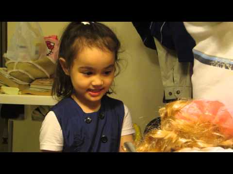 isla and appa listening to her new bday present doll