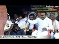 Vijayakanth fans his assistant during a election meeting