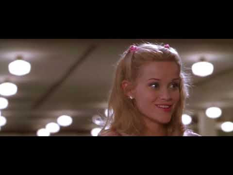 Legally Blonde official trailer frame: Elle Woods striding across Harvard Yard with textbooks and Bruiser