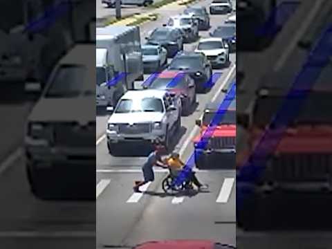 ‘Spider-Man’ helps someone 
cross the street