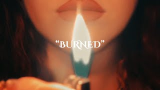 Kadr z teledysku Burned tekst piosenki Britton