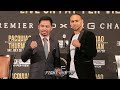 MANNY PACQUIAO SIZES UP KEITH THURMAN DURING FACE TO FACE IN LOS ANGELES