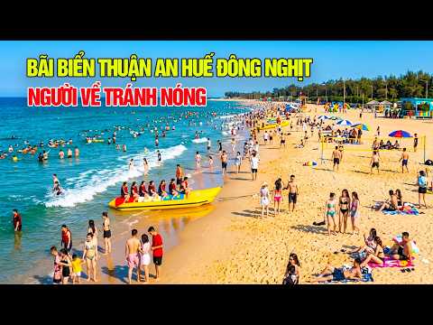 Thuan An beach is packed with people seeking refuge from the intense summer heat of Hue.