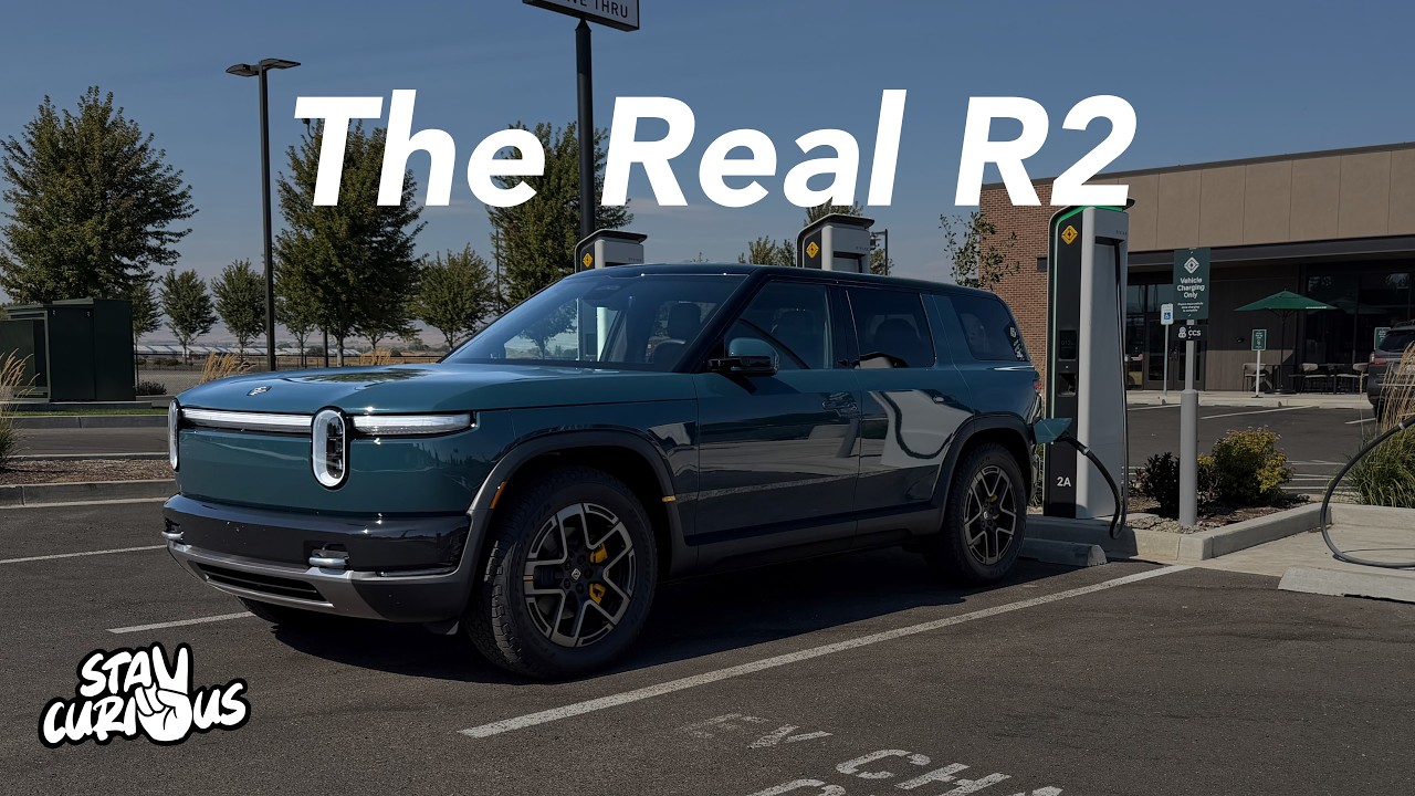 Rivian R2 parked on a wet Pacific Northwest road