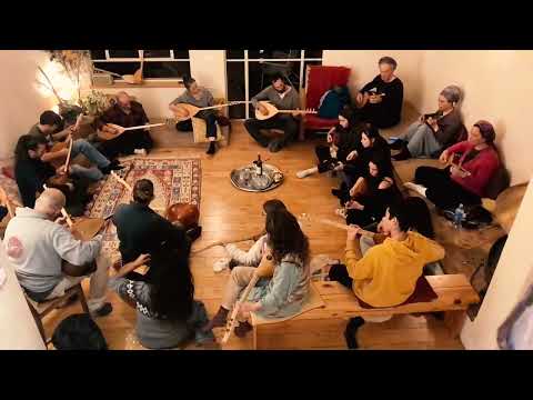 Students of all ages play saz baglama in Barak's course