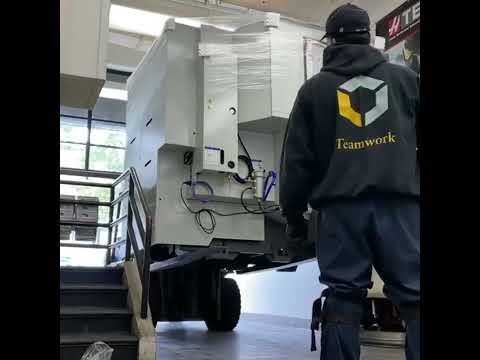 ￼New Haas UMC500 5-axis machining center