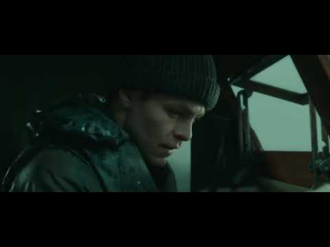 Official trailer still from The Finest Hours: Coast Guard motor lifeboat CG 36500 facing towering waves at night