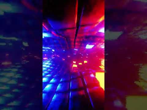 4K VJ Loop. Flying through a futuristic tunnel with neon lights.