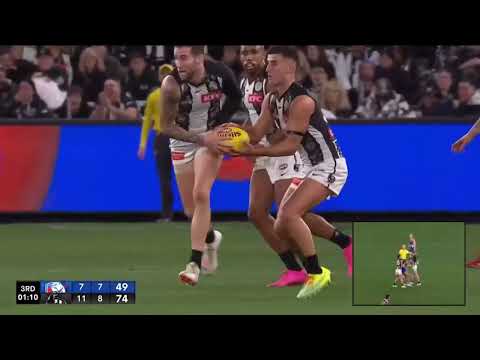 Nick Daicos steals a possession from Jeremy Howe
