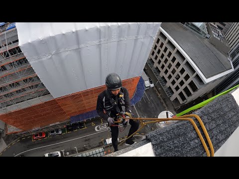 Rope access technician window cleaning in galaxy world #irata #ropeaccess #abseiling
