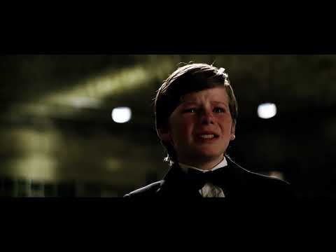 Trailer frame of the Tumbler racing across rooftops of Gotham at night