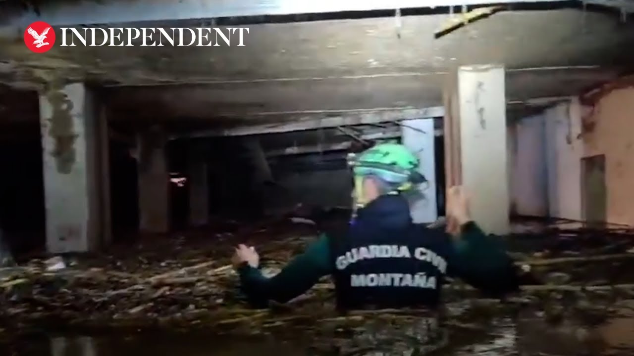 Spain floods: Rescuers wade through chest-high water as death toll exceeds 200