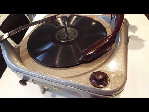 V-M 3 speed automatic record player playing a 78 RPM record.