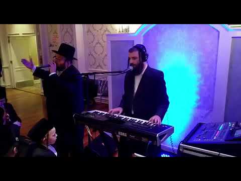 Chezky Levy and Shmily Spira performing the kiddish song