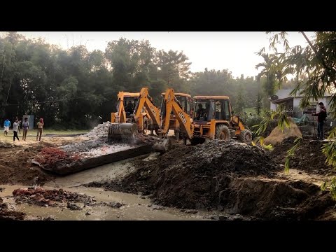 Three JCB Backhoe Loader Throwing Out Broken Bridge Concrete