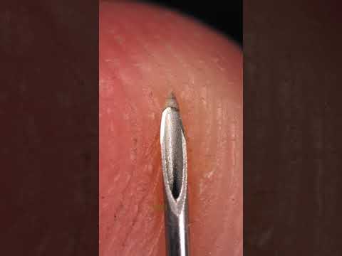 Needle and Fingerprint Close-Up