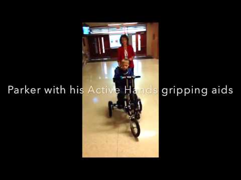 Riding a trike with Micro Cephaly | Active Hands Gripping Aids