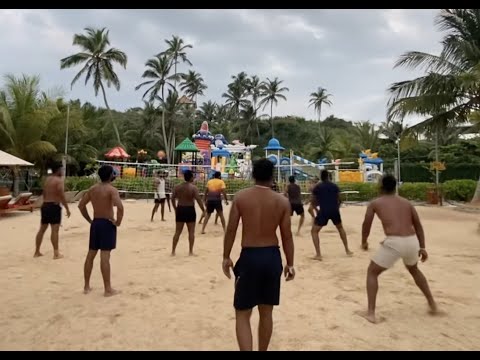 Team relaxing with some Beach Volleyball