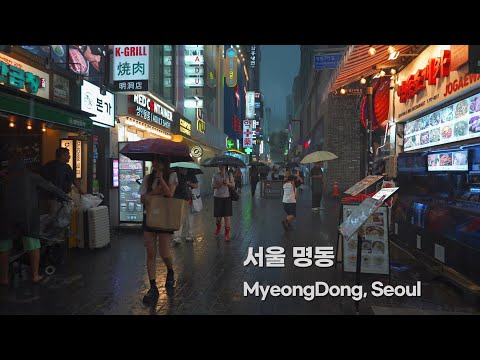 Walk in the rain in Myeongdong Seoul. White noise in the city, a rainy day, people seeking happiness