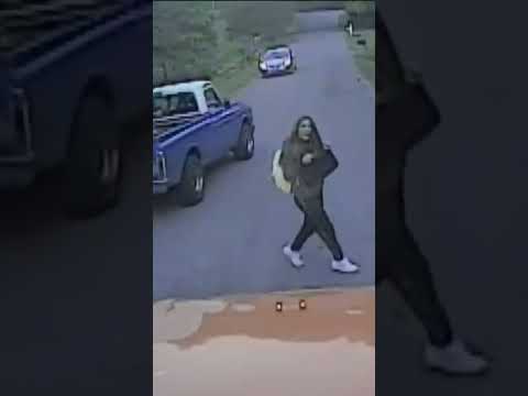 Video shows girl’s frightening brush with truck running school bus stop sign