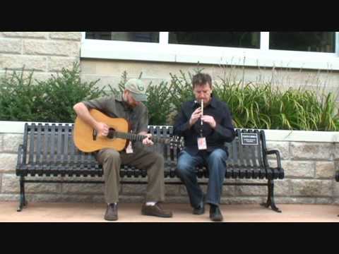Larry Nugent and Patsy O'Brien perform on Floyd's Bench in Muskegon, MI.