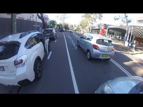 CLOSE CALL - Cyclist almost hit by car door