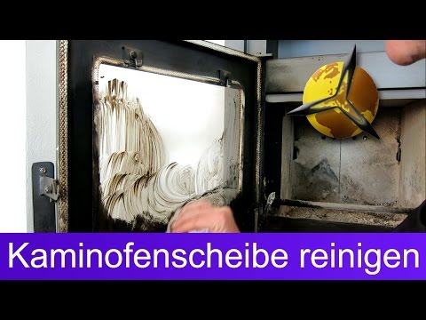 Cleaning the fireplace glass: Cleaning the fireplace glass with ash