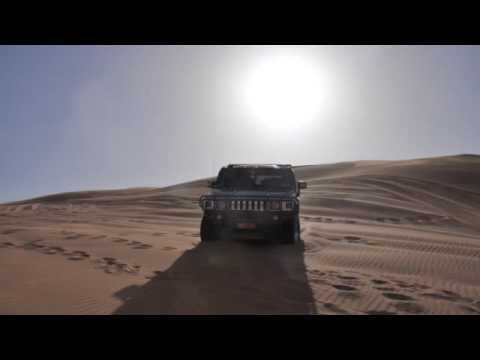 Hummer H2 and  two Toyota Landcruisers playing in Oman