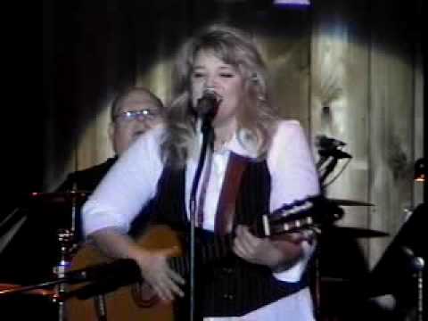 Julie Williams sings an original song at the Kentucky Opry