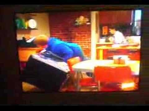 kid picks up refrigerator