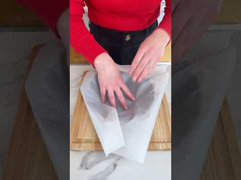 How to make a cartouche! Simple parchment trick for lining round cake pans. #baking #cake