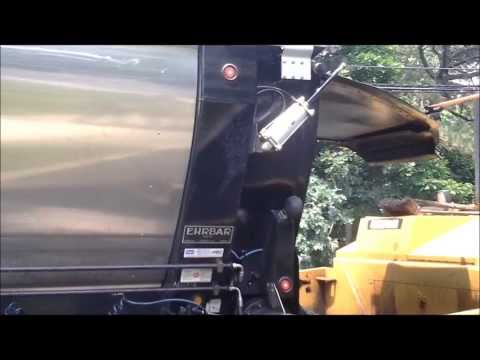 Live Bottom Trailer Asphalt paving under trees