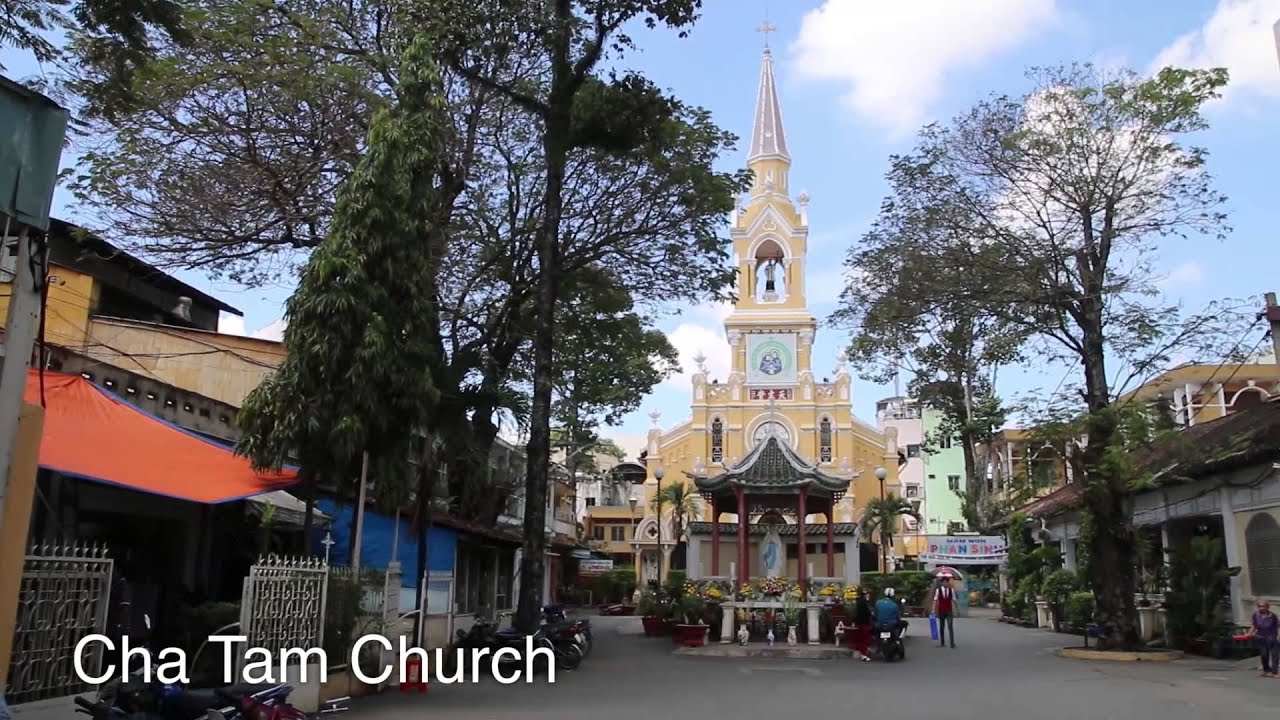 Experience a food tour at the bustling Binh Tay Market as an adventurous traveler.
