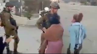 Tamimi was arrested by Israeli authorities on Dec. 19 and faces 12 charges — including aggravated assault and throwing stones. She appeared in court the following day and recounted her version of events. 
She said that an hour before the incident, soldiers from the IDF had shot her cousin Muhammad Tamimi in the head at point-blank range with a rubber bullet. “Then I saw the same soldiers who hit my cousin, this time in front of my house. I could not keep quiet and I responded as I did,” she told the court, the Times of Israel reported. 
Photos of her cousin have also been widely shared online, and show a young boy with a badly injured face. A later YouTube video showed the extent of his injuries, sustained — his family says — when he was hit by a rubber bullet after he climbed a wall to look at soldiers in a newly built compound at the edge of his village.