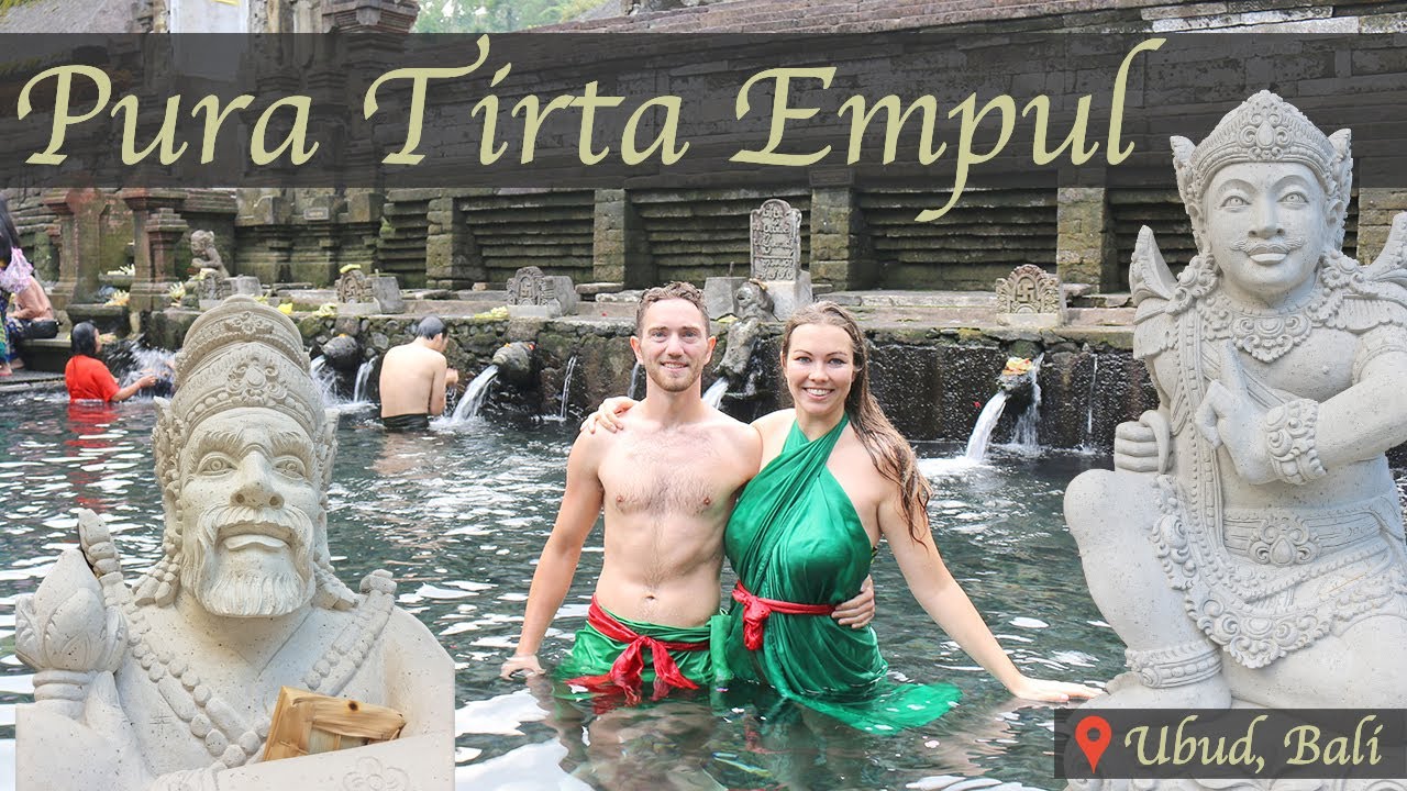 Travelers immerse in the cultural exploration of Tirta Empul Temple.