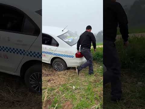 While Reversing, The Car Accidentally Fell Off The Curb, With The Wheels Dangling In The Air.