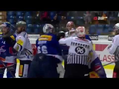Swiss ice hockey fight between the goalkeeper and forward