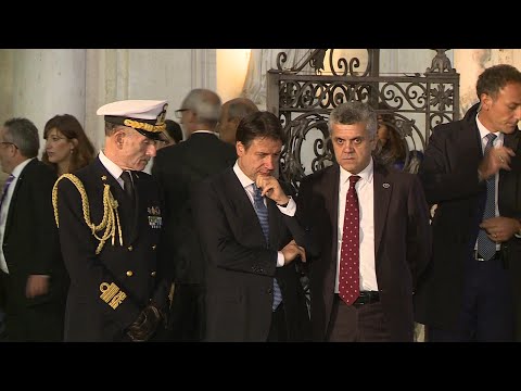 Italian Prime Minister Giuseppe Conte greets German Chancellor Angela Merkel | AFP