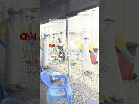 Healthcare workers celebrate as last patients leave Ebola clinic