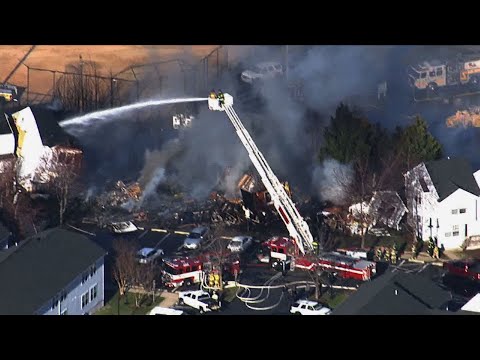 Authorities in Maryland say two people are dead and eight firefighters were hurt in a multi-alarm blaze in which four town houses collapsed. Officials say firefighters could not rescue the two people who died from one town house. (April 4)